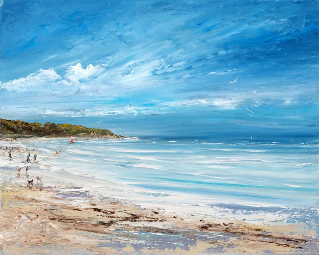 A vibrant seascape print featuring Orcombe Point end of Exmouth's sandy beach. Gentle waves and a bright blue sky with wispy clouds. People are enjoying the beach, with some walking along the shore with their pets and other flying their kites.