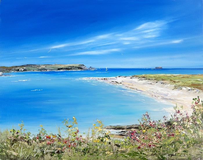 Rock Beach looking towards Stepper Point nr Padstow is a  painting of a serene seascape featuring a blue sky, clear turquoise water, sandy beach, and colorful wildflowers in the foreground. Framed print available to buy direct from the artist Gail Morris.
