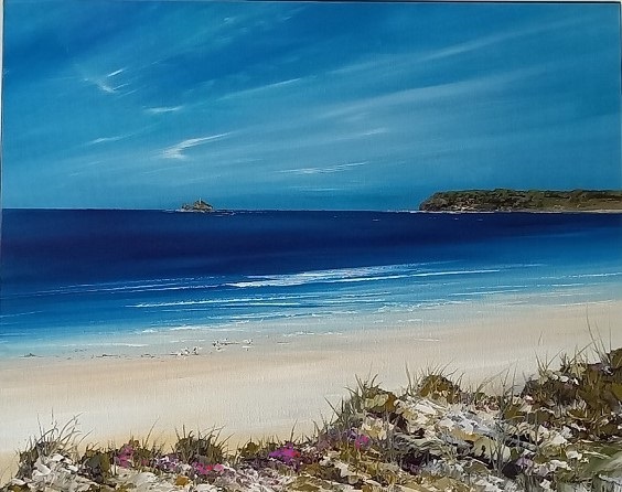 A scenic painting and print of a Hayle beach through the Gwithian Towans in Cornwall with golden sand, vibrant blue sea, and a clear sky. In the distance, there is Godrevy Lighthouse with greenery, and the foreground features some grass and sea-pink flowers.
