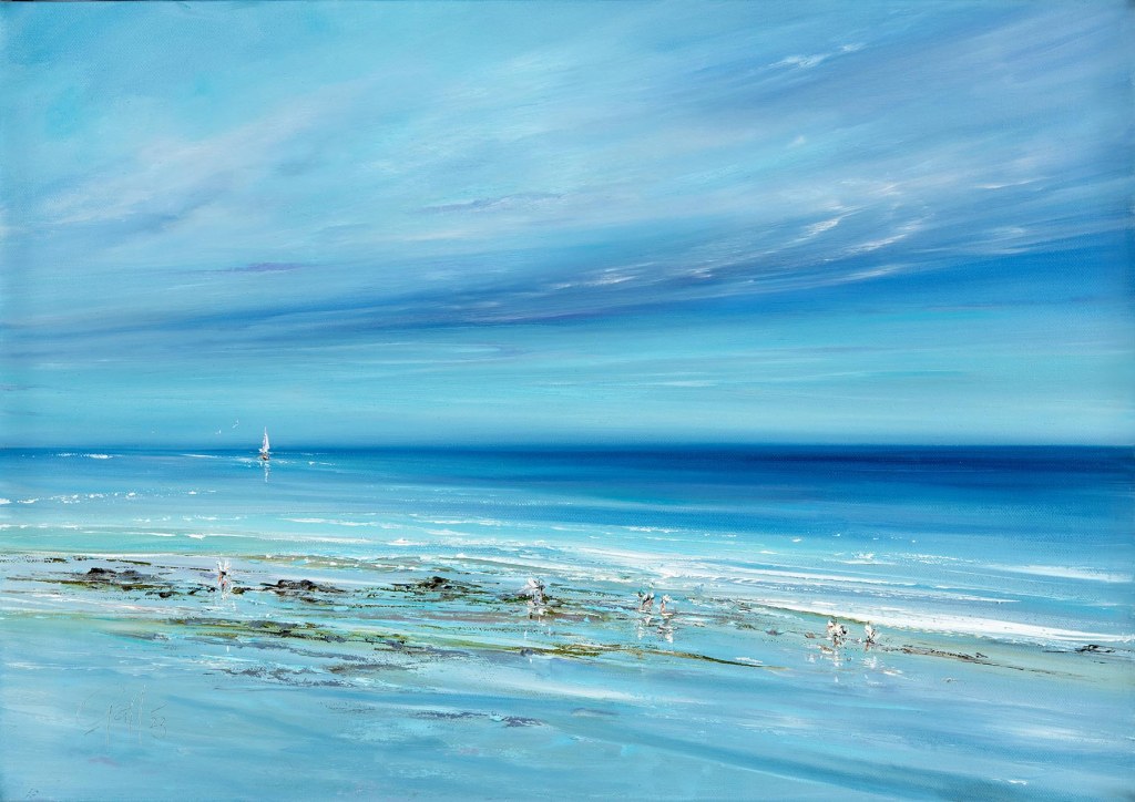 A serene seascape print featuring a calm blue ocean with gentle waves and a sailboat in the distance under sky filled with floating clouds of many gentle colours. Seabirds feed along the shoreline.