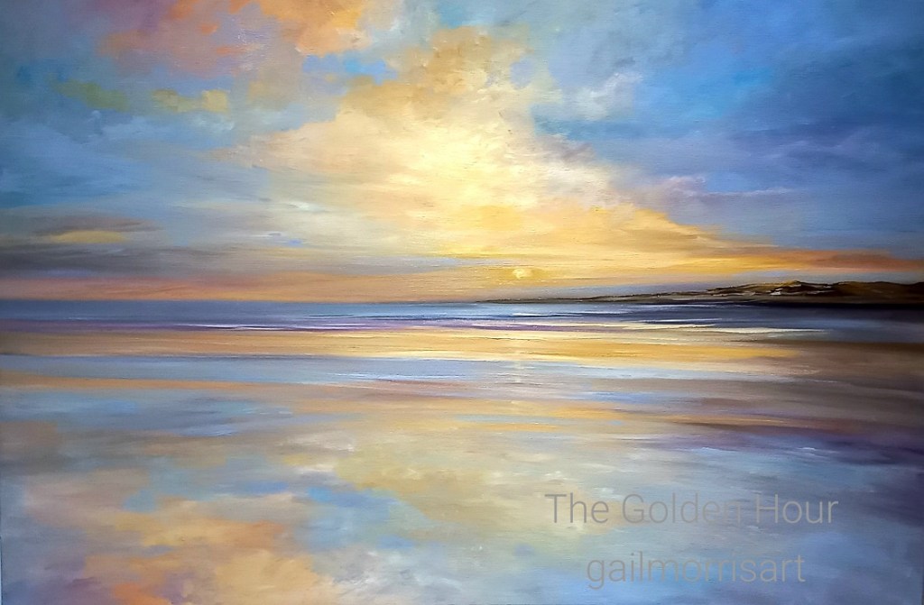 A beautiful landscape print titled 'The Golden Hour' featuring a serene seascape with soft, warm colours reflecting on the water during sunset over Exmouth Beach.