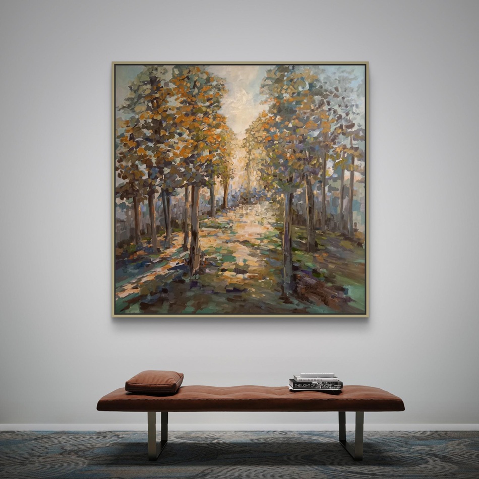 A serene landscape painting featuring trees with colorful foliage hanging on a wall above a modern brown bench, in a simple and stylish room setting.